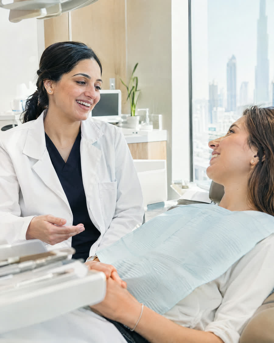Dentist talking with a relaxed patient